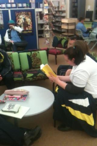 Students reading to each other.